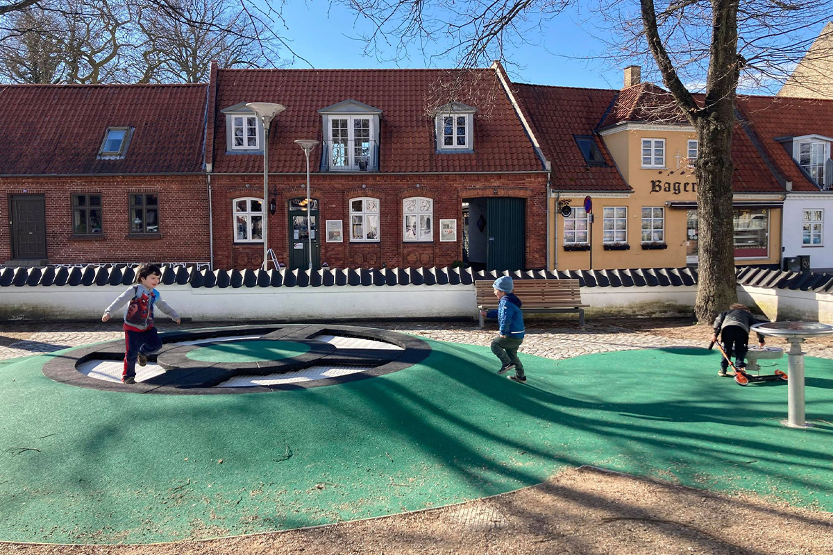 Two kids playing at the playground area